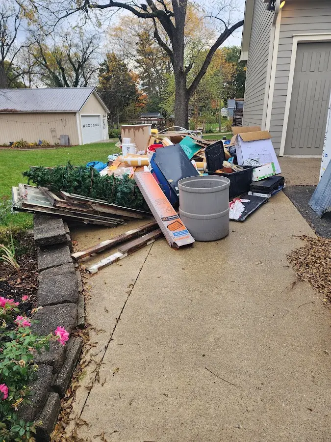 Dumpster being loaded with debris for Demolition Dumpster Rental in Hinsdale